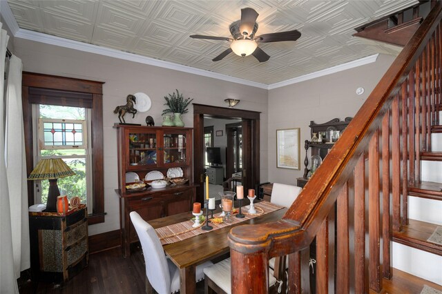 dining room with dark wood-type flooring, stairway, and an ornate ceiling