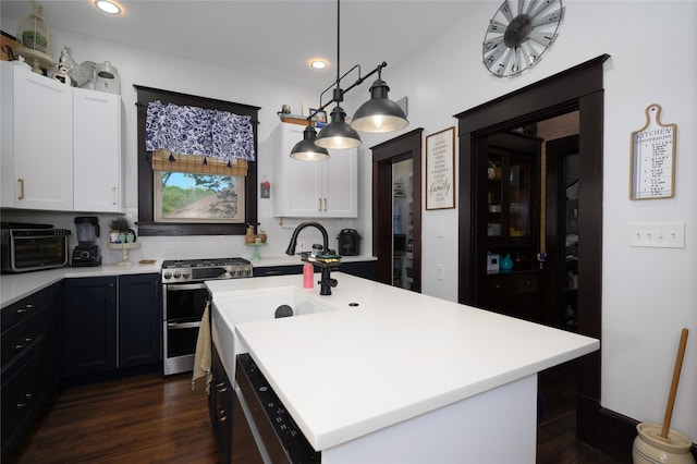 kitchen featuring light countertops, white cabinetry, and appliances with stainless steel finishes