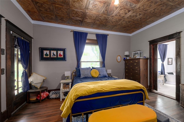 bedroom with an ornate ceiling, wood finished floors, and ornamental molding