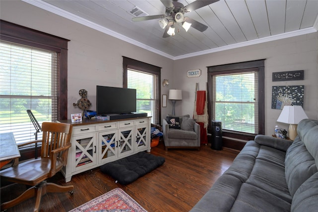 living room with ceiling fan, crown molding, wood finished floors, and visible vents