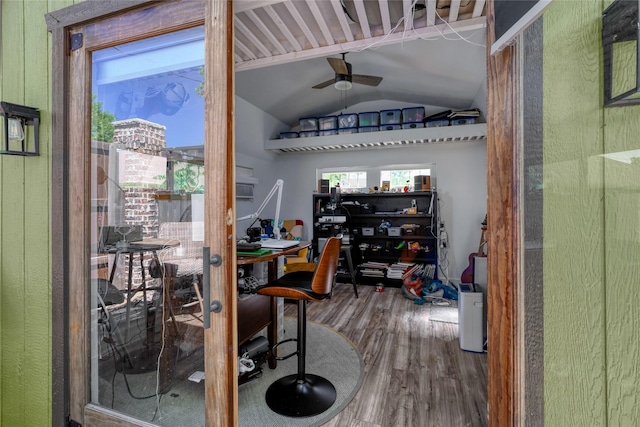 office with a ceiling fan, vaulted ceiling, and wood finished floors