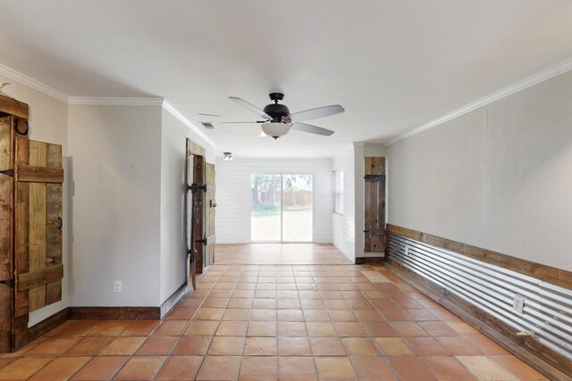 empty room featuring visible vents, crown molding, ceiling fan, and light tile patterned floors