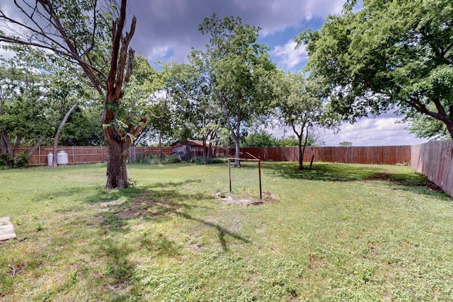 view of yard with a fenced backyard