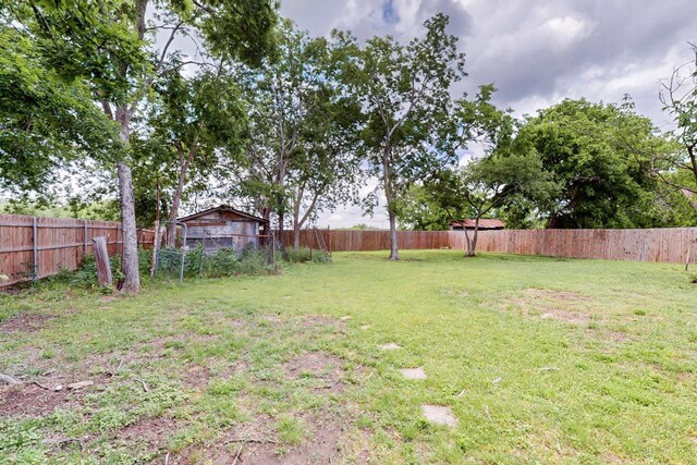 view of yard with a fenced backyard