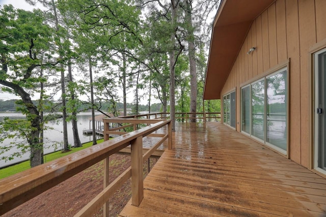 exterior space featuring a deck with water view
