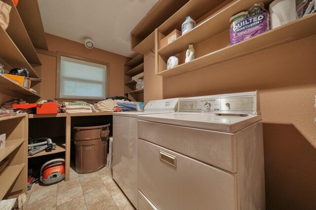 washroom featuring washer and dryer and laundry area