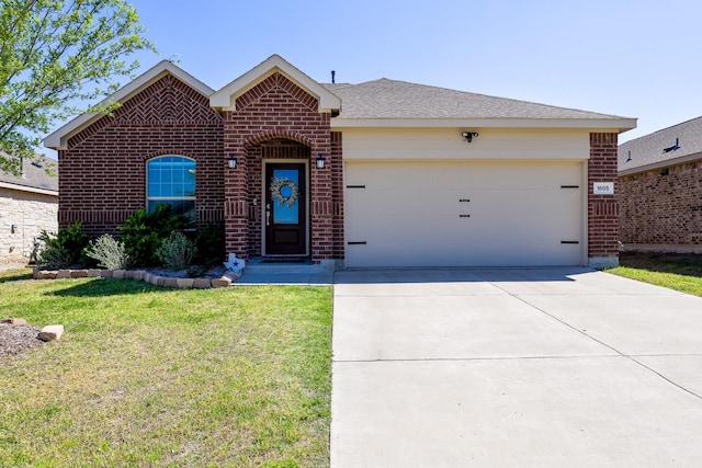 view of front of property with concrete driveway, a front lawn, brick siding, and an attached garage