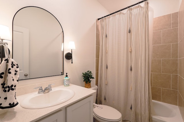 bathroom with shower / bath combo, toilet, and vanity