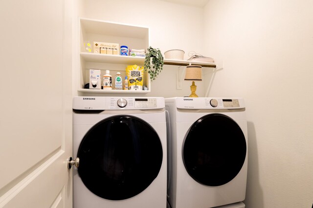 laundry room featuring washing machine and dryer and laundry area