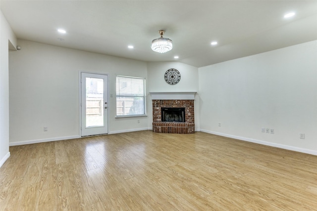 608 Piper Dr, Saginaw, TX 76179 - unfurnished living room with baseboards, recessed lighting, wood finished floors, and a fireplace