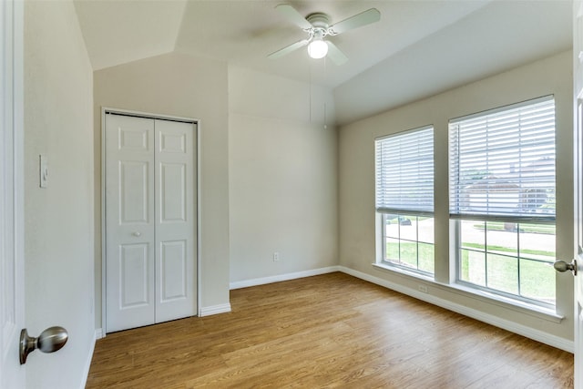 608 Piper Dr, Saginaw, TX 76179 - unfurnished bedroom featuring baseboards, vaulted ceiling, a closet, and light wood-style flooring