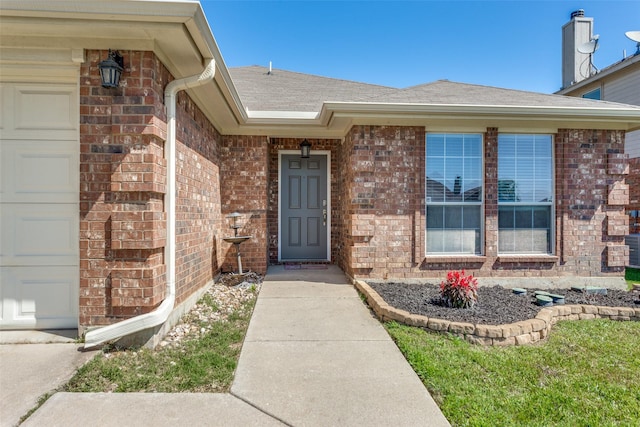 608 Piper Dr, Saginaw, TX 76179 - entrance to property with brick siding, roof with shingles, and a garage