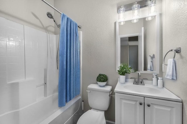full bath featuring vanity, a textured wall, and shower / bath combo with shower curtain