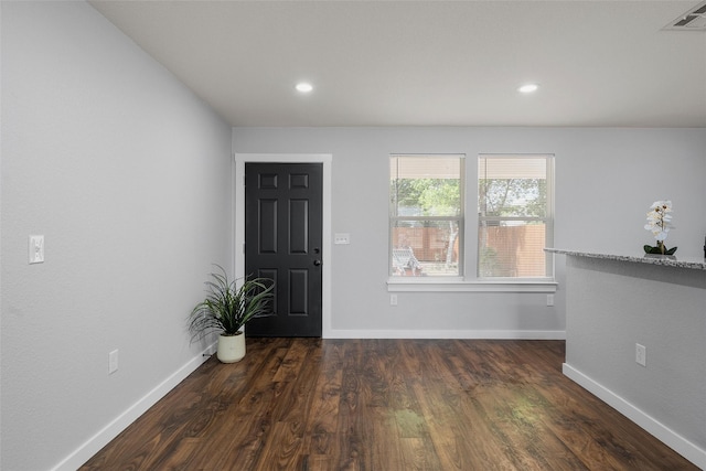 1124 Faulkner Ln, Waco, TX 76704 - foyer with baseboards, dark wood-style floors, and recessed lighting