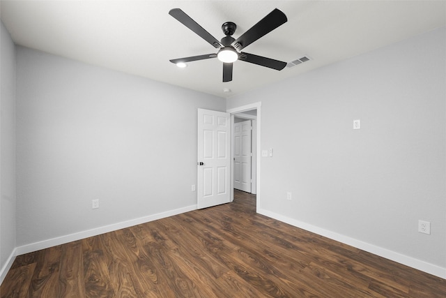 1124 Faulkner Ln, Waco, TX 76704 - unfurnished bedroom with baseboards, dark wood-type flooring, and ceiling fan