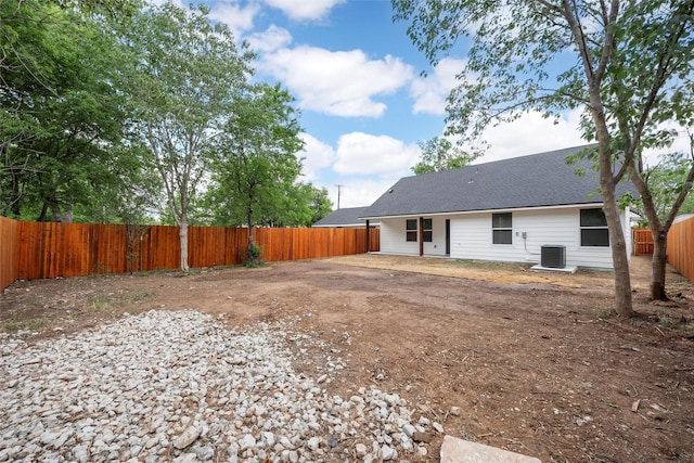 1124 Faulkner Ln, Waco, TX 76704 - rear view of property with a fenced backyard, a shingled roof, and central air condition unit