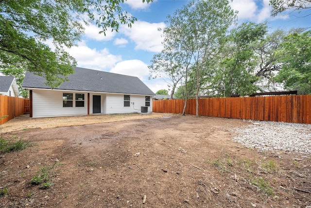1124 Faulkner Ln, Waco, TX 76704 - back of house featuring a fenced backyard, cooling unit, and a shingled roof