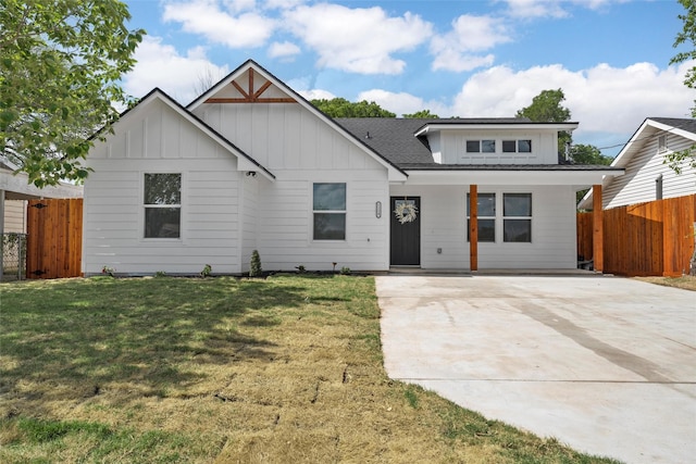 1124 Faulkner Ln, Waco, TX 76704 - modern farmhouse with driveway, board and batten siding, covered porch, and roof with shingles