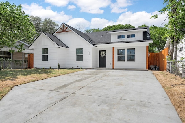 1124 Faulkner Ln, Waco, TX 76704 - modern farmhouse with concrete driveway, board and batten siding, and a shingled roof