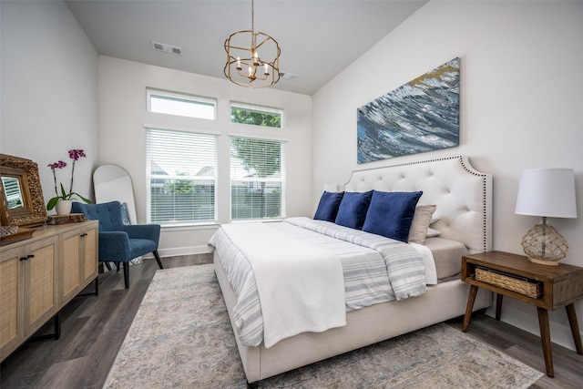 bedroom featuring an inviting chandelier, dark wood-style flooring, visible vents, and baseboards