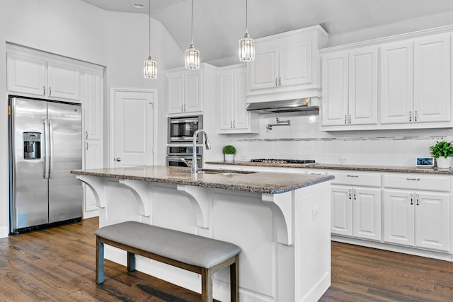 1884 Knoxbridge Rd, Forney, TX 75126 - kitchen featuring white cabinets, dark stone countertops, a sink, decorative backsplash, and appliances with stainless steel finishes