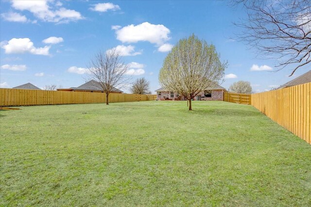 view of yard with a fenced backyard