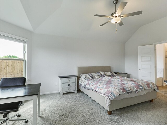 bedroom featuring lofted ceiling, baseboards, carpet floors, and ceiling fan
