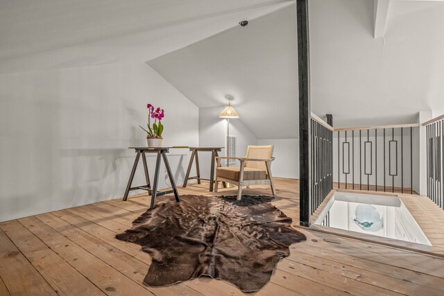interior space featuring vaulted ceiling and hardwood / wood-style floors