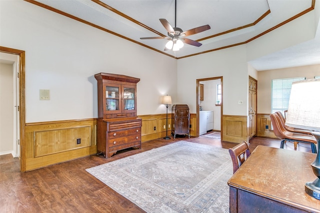 office with wood finished floors, wainscoting, ceiling fan, washing machine and dryer, and ornamental molding