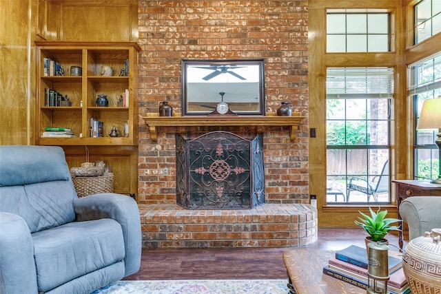 living room featuring wood walls and wood finished floors