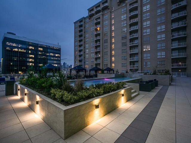 3225 Turtle Creek Blvd Unit 206, Dallas, TX 75219 - view of patio with a city view, a community pool, and a gazebo