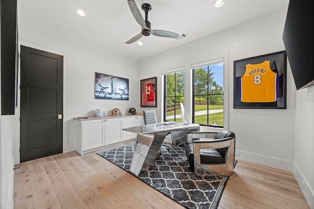 office featuring baseboards, a ceiling fan, light wood finished floors, and recessed lighting