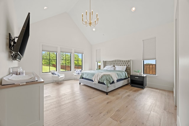 bedroom featuring high vaulted ceiling, a chandelier, light wood-style flooring, baseboards, and recessed lighting