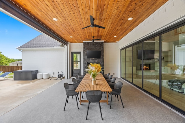 view of patio / terrace featuring fence, a ceiling fan, and outdoor dining space