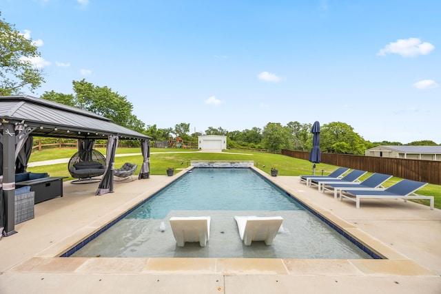 view of swimming pool featuring a fenced in pool, fence, a yard, a patio area, and a gazebo