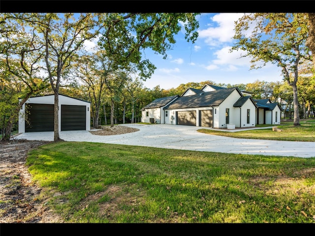 612 Glade Stream Ct, Azle, TX 76020 - modern farmhouse featuring concrete driveway, a front lawn, an outdoor structure, and a garage
