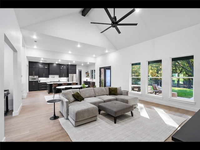 612 Glade Stream Ct, Azle, TX 76020 - living room featuring beamed ceiling, light wood-style flooring, high vaulted ceiling, and recessed lighting