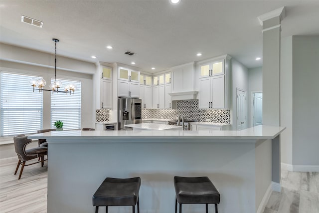 1301 Meadows Ave, Lantana, TX 76226 - kitchen with visible vents, baseboards, and stainless steel fridge with ice dispenser
