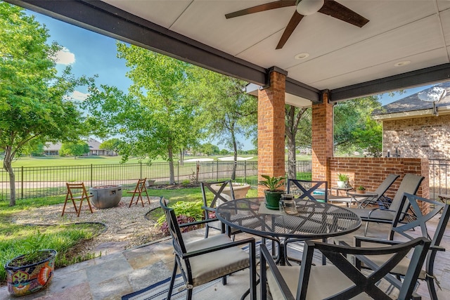 1301 Meadows Ave, Lantana, TX 76226 - view of patio / terrace with a fenced backyard, outdoor dining area, and ceiling fan