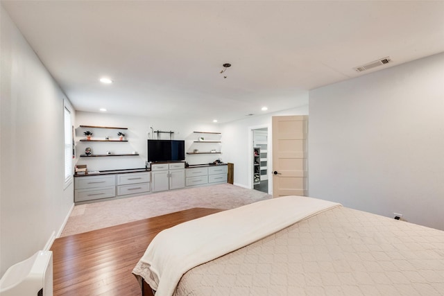 5102 Galaxie Rd, Garland, TX 75044 - bedroom featuring recessed lighting, light wood-style flooring, and a walk in closet