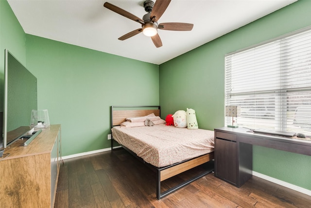 5102 Galaxie Rd, Garland, TX 75044 - bedroom with multiple windows, dark wood-style flooring, and ceiling fan