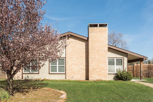 5102 Galaxie Rd, Garland, TX 75044 - view of property exterior featuring a chimney and brick siding