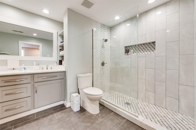 5102 Galaxie Rd, Garland, TX 75044 - bathroom featuring vanity, a walk in shower, tile patterned flooring, and recessed lighting