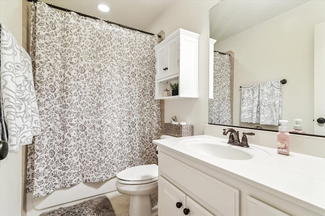 bathroom with toilet, tile patterned floors, and vanity