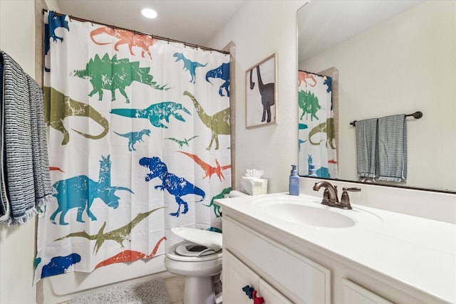 bathroom featuring tile patterned floors, vanity, recessed lighting, and toilet