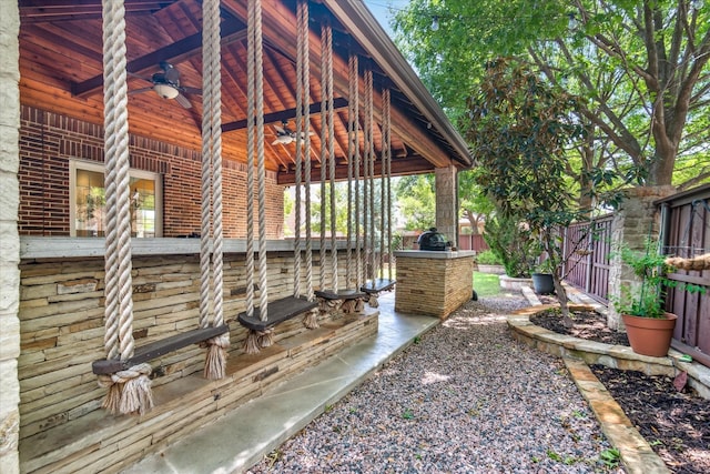 view of yard with fence and ceiling fan