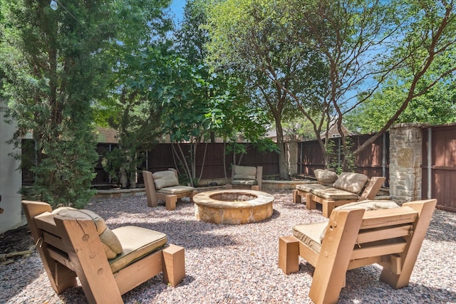 view of patio / terrace with an outdoor fire pit and a fenced backyard