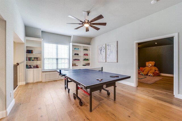 rec room with light wood finished floors, baseboards, and a ceiling fan