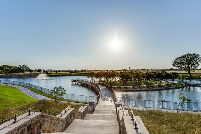 view of community with a water view
