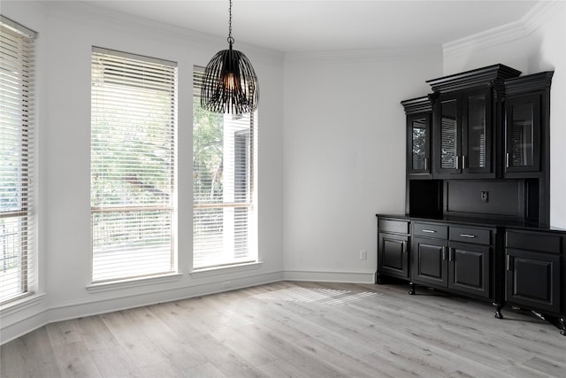 422 Mustang Dr, Sunnyvale, TX 75182 - unfurnished dining area featuring a chandelier, light wood-style flooring, ornamental molding, and baseboards